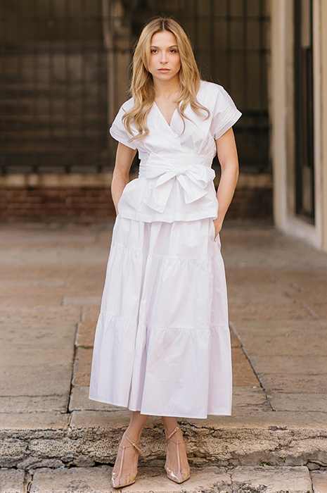 Woman in white maxi skirt and blouse